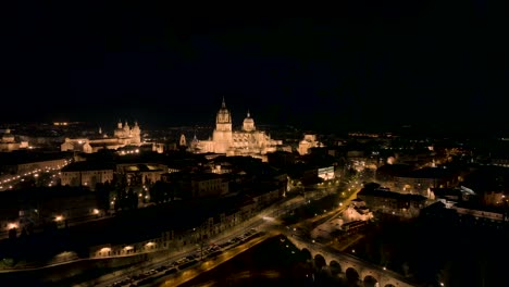 orbit shot at night time of distinctive basilica in heart of salamanca city, spain