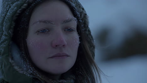 woman with frost on face in a cold winter environment