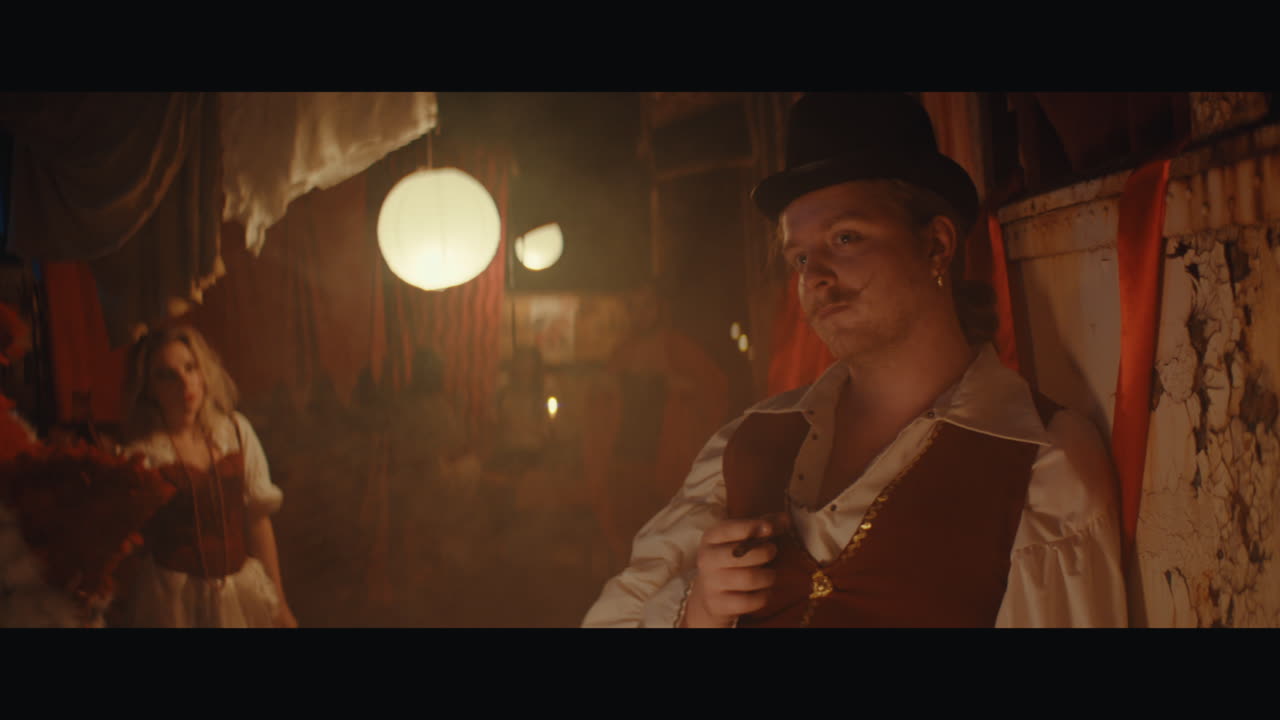 A man in mustache in the circus camp