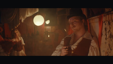 a man in mustache in the circus camp