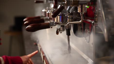 barista preparing coffee with espresso machine