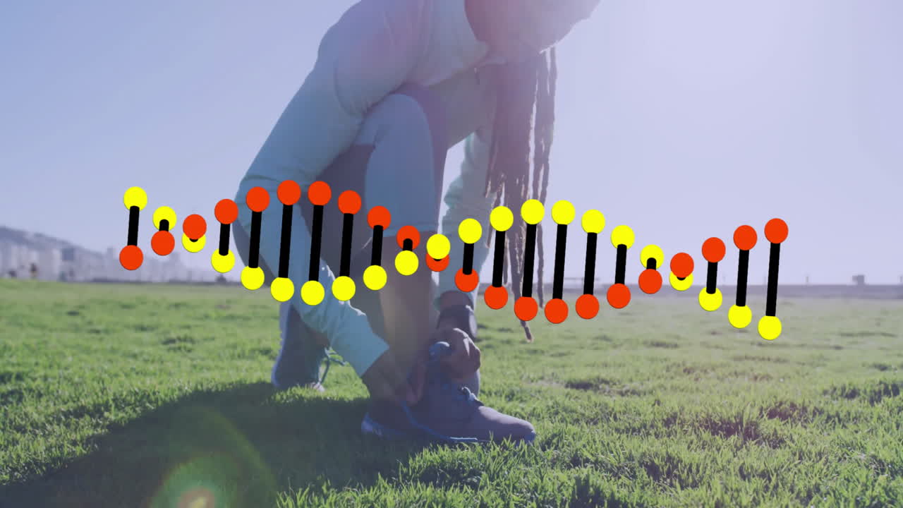 Person tying shoelaces on grass with DNA strand animation overlay