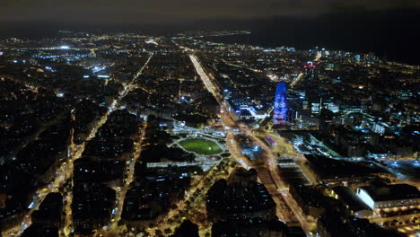 Aerial-Shot-Of-Plaza-De-Las-Glorias-Catalanas-At-Night,-Barcelona,-Spain