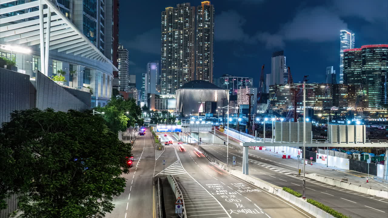 Time lapse of night view on Austin road and Xiqu Centre in Kowloon Hong Kong