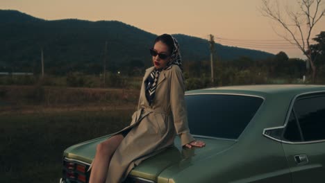 vintage woman by classic car