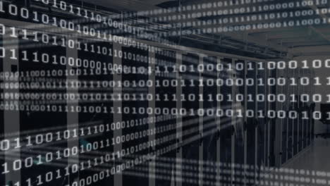 Binary code animating over server racks in data center