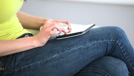 woman using digital tablet