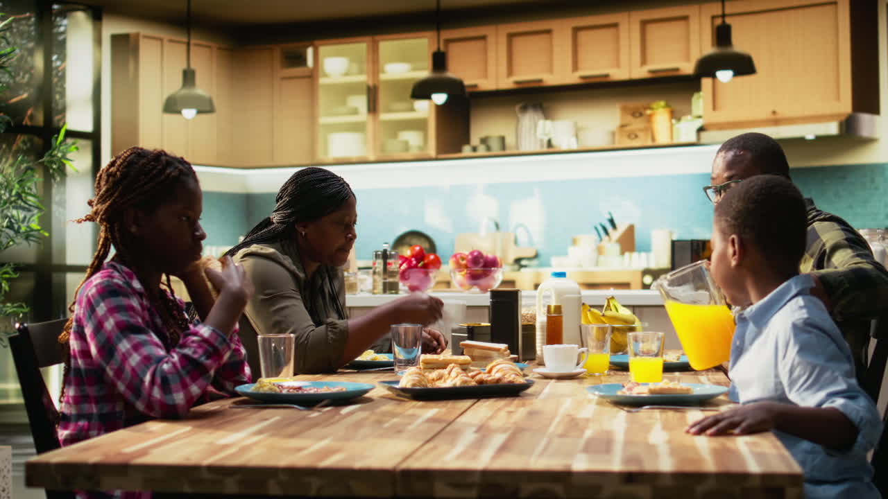 Family having breakfast in the kitchen