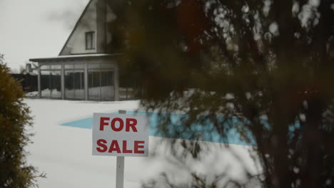 for sale banner on a house