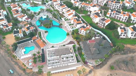 Aerial-view-of-a-luxury-hotel-along-the-coast-Hotel-Princess-Fuerteventura,-Canary-Islands,-Spain