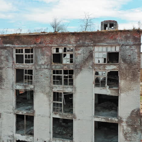 aerial view of an old factory ruin and broken windows. old industrial building for demolition.