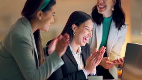 Laptop,-high-five-and-applause-with-business-women