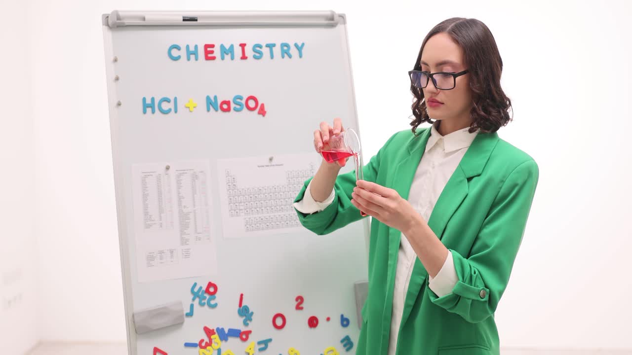 Woman performing a chemistry experiment in a lab setting