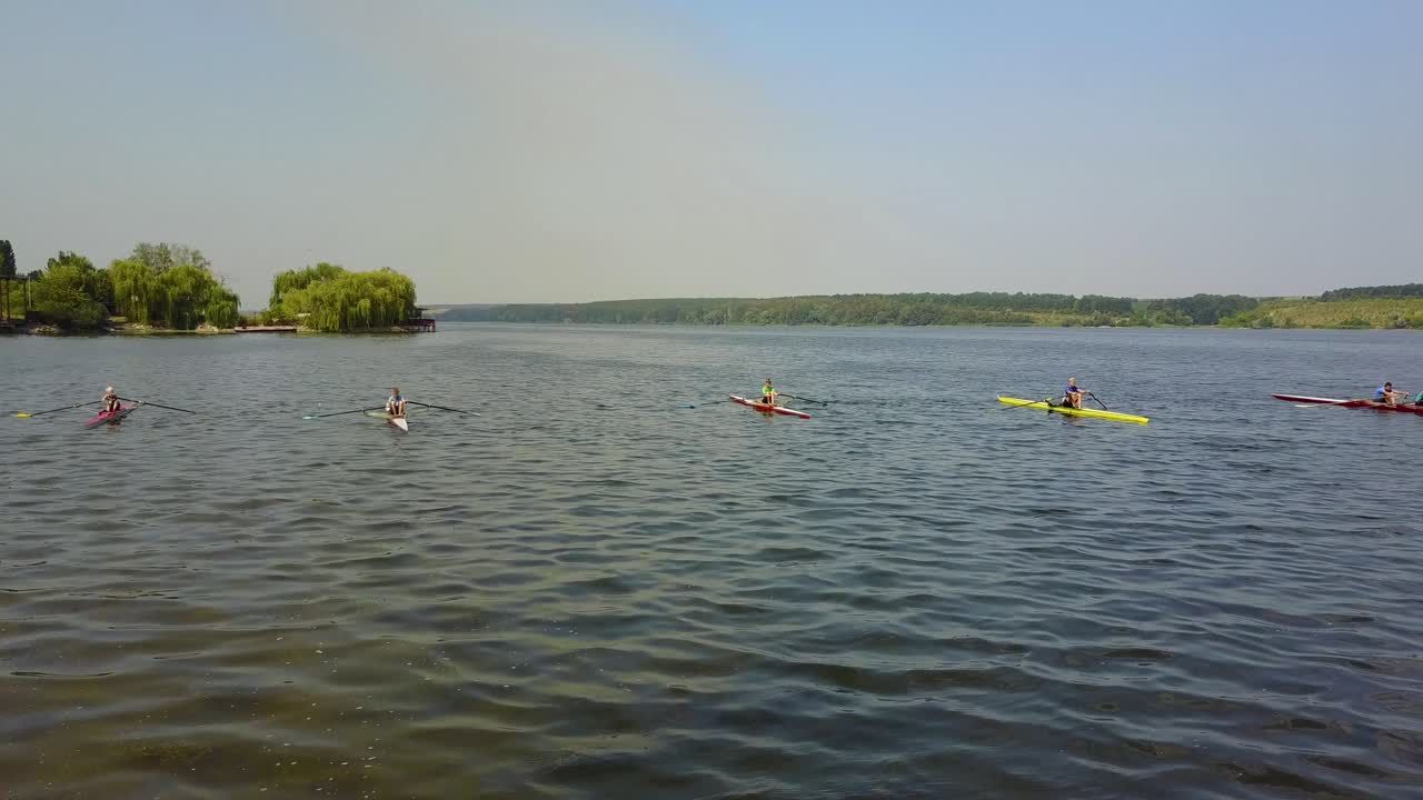 Training Athlete In Kayak. Training of small sportsmen rowers on a kayak on the river