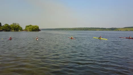 training athlete in kayak. training of small sportsmen rowers on a kayak on the river