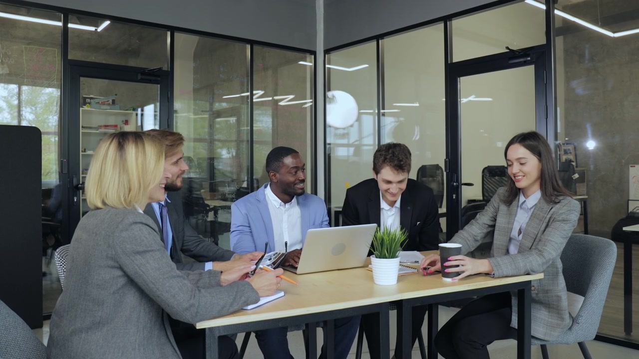 Happy Business People Collaborating in a Modern Office Meeting