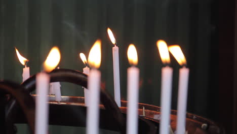 candles burning in buddhist temple shrine in japan