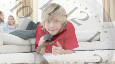 clock animation over child holding remote control and watching television