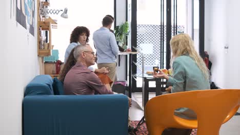 Businesswoman explaining project to coworkers in slow motion