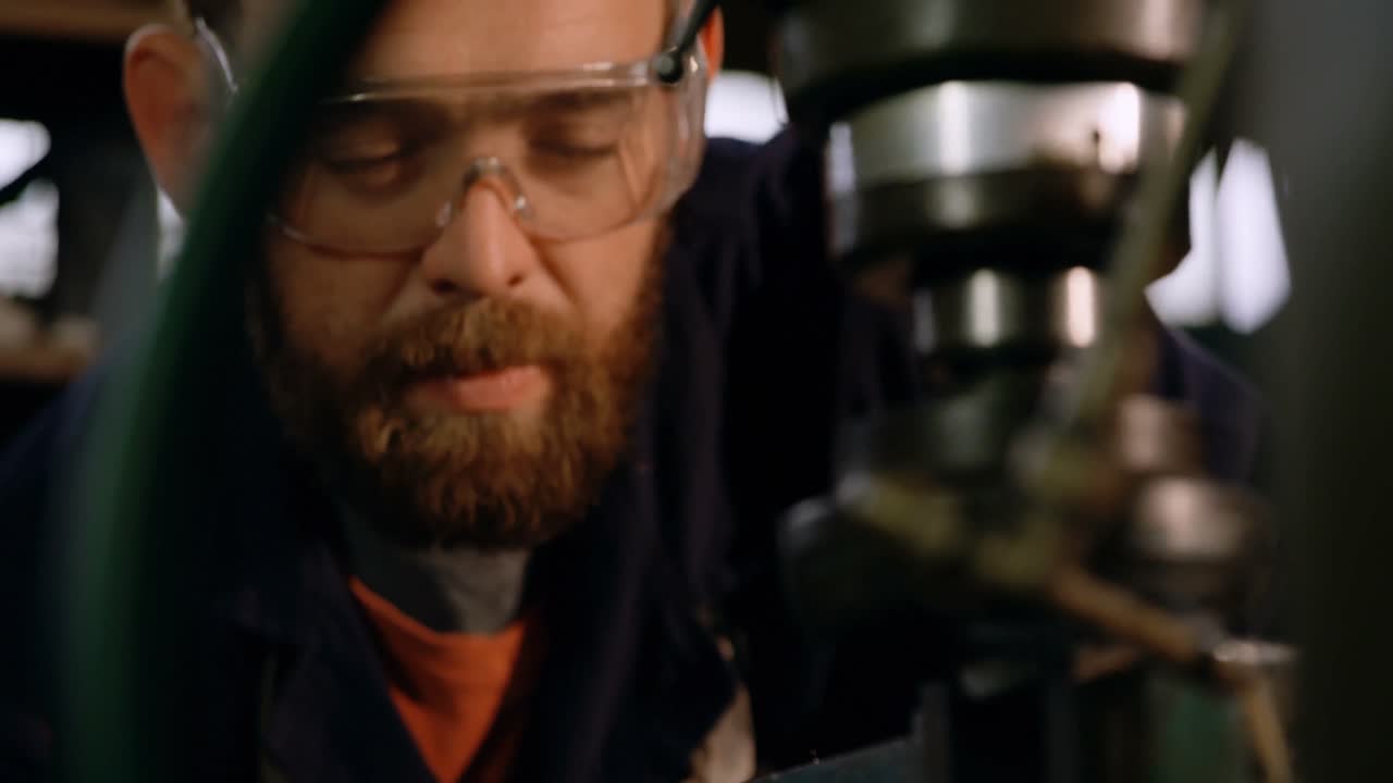 Metalsmith working in workshop 4k