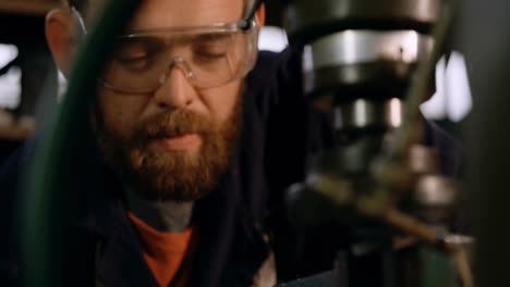 metalsmith working in workshop 4k