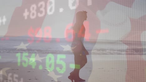 stock market data processing against caucasian couple walking together on the beach