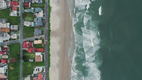 a perfect division between houses and the beach creates a harmonious blend of urban and natural landscapes