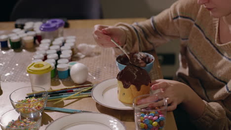 woman decorating easter bread