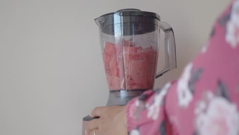 making watermelon smoothie in a blender