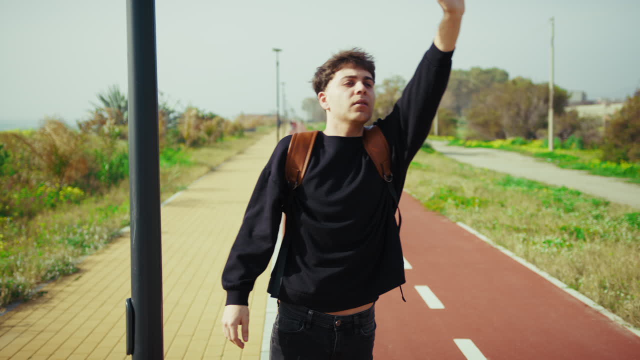 Man Trying To Stop A Taxi While Waiting Outdoor To Return Home