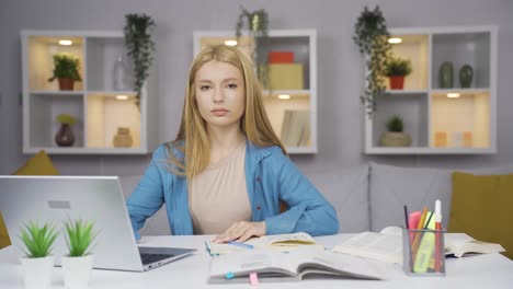 female student experiencing joy looking at camera.