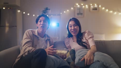 couple watching movie at home