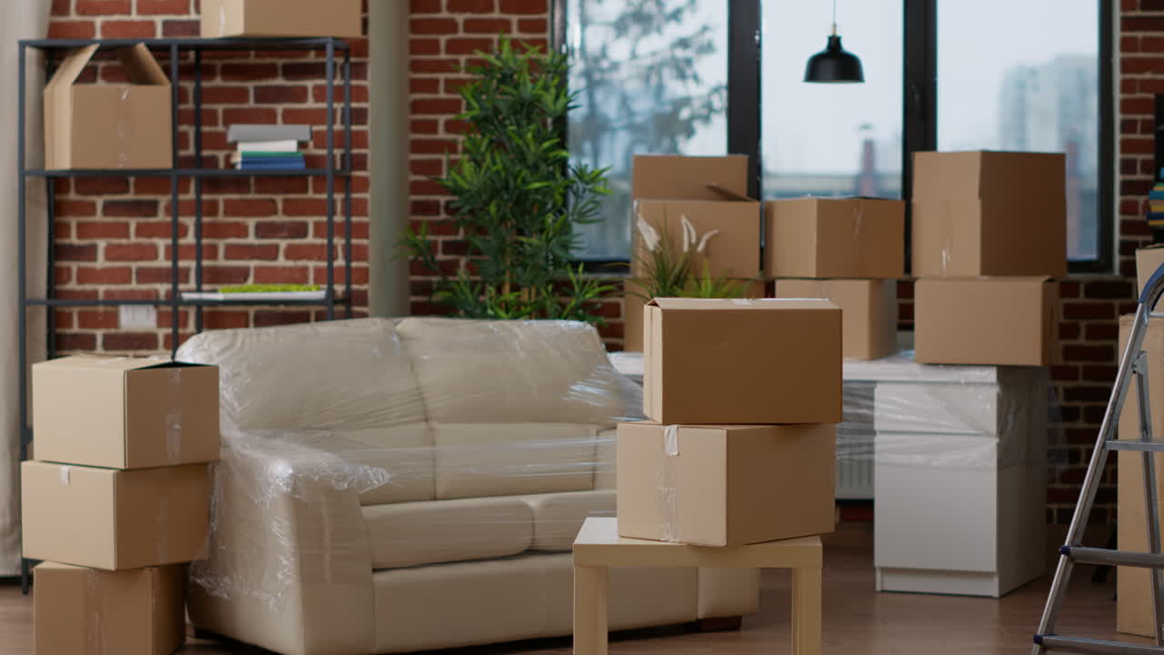 No people in empty real estate apartment with moving boxes