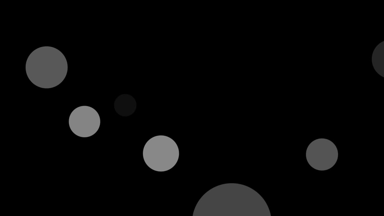 Abstract animation of white and gray bokeh circles floating on black background. For creating dreamy, soft, or atmospheric visuals