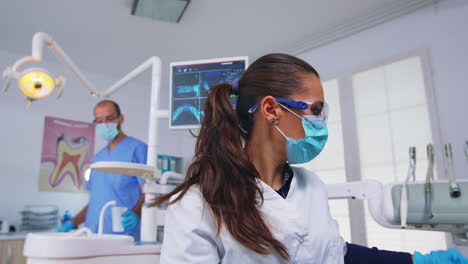 patient pov to doctor in stomatological office treating teeth