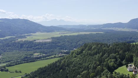 aerial over forest landscape near market town of lavamund in austria