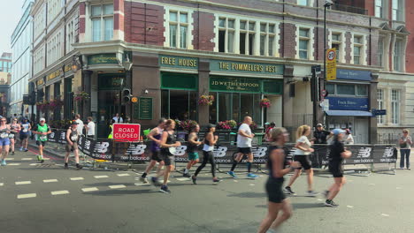 fun runners travel south on tower bridge road, london in the big half 2024