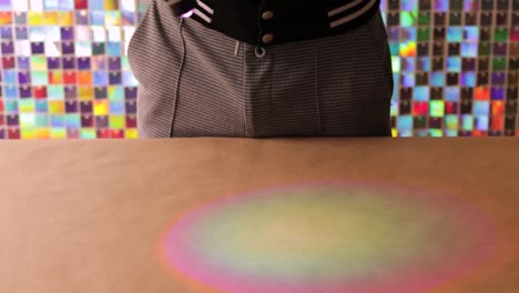 small usb light projects colorful glow on surface with vibrant mosaic background