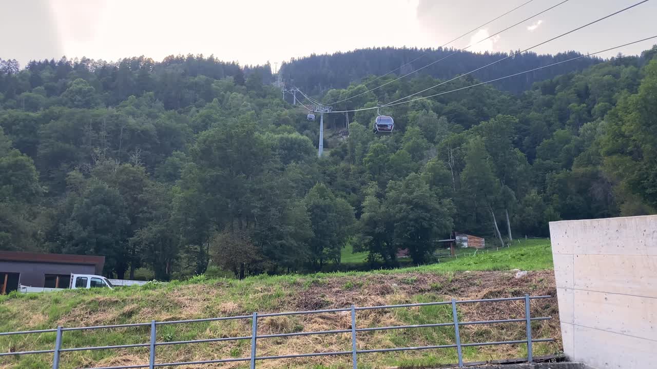 Gondolas leave lower station of cable car to Eggishorn, Aletsch Glacier, Switzerland