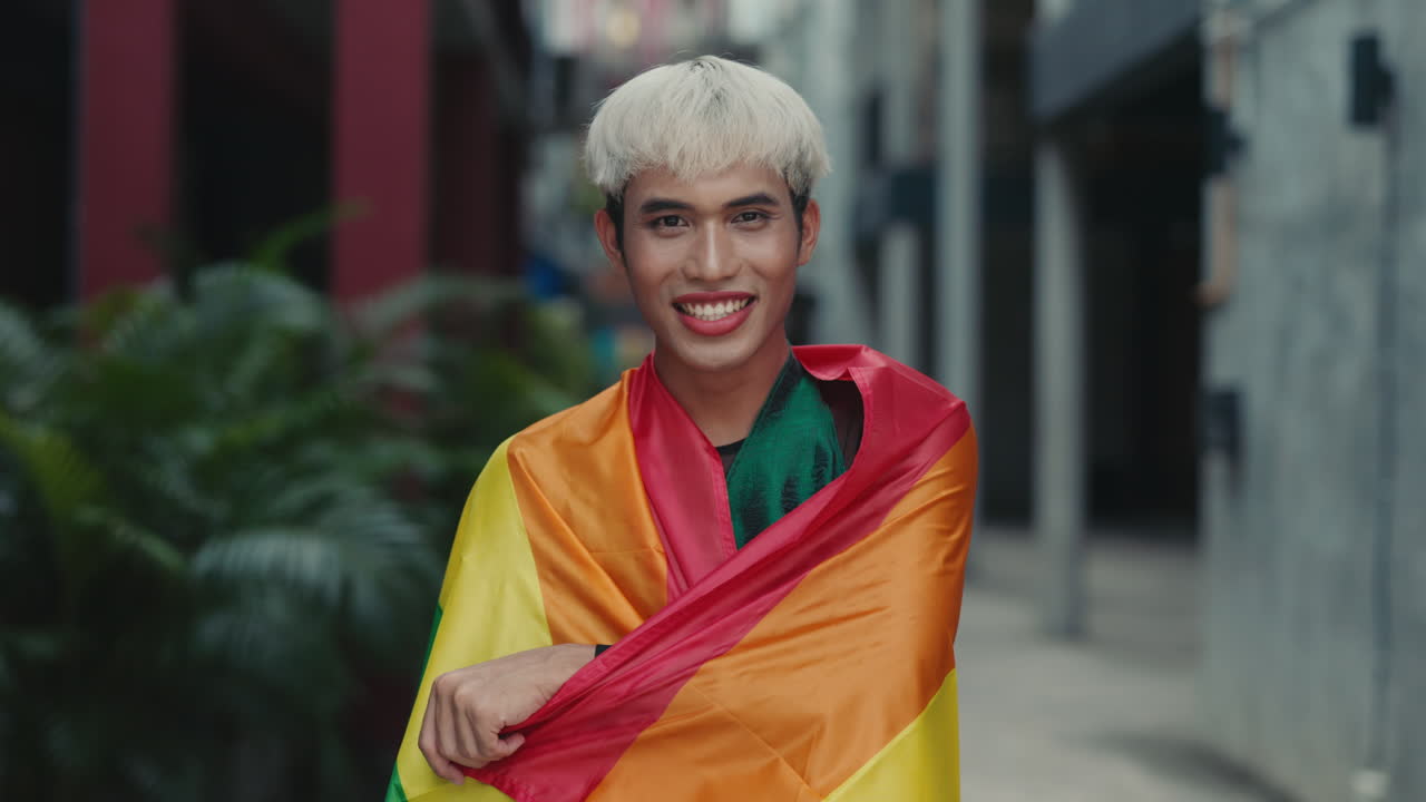 Happy Person Wrapped in Pride Flag