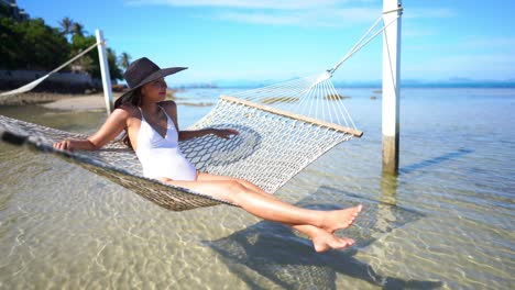 beautiful woman relax on hammock or swing around sea beach ocean for leisure travel and vacation