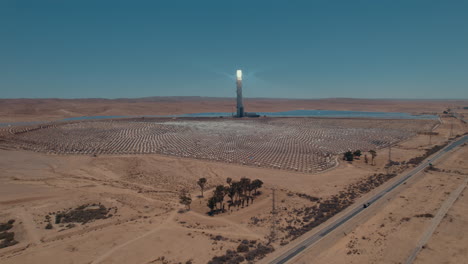 huge solar power station from distance in the desert of iarael, ashalim power station -slow tracking paralax drone shot