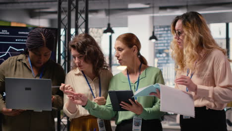 vertical video strong diverse team of women works together on project analysis