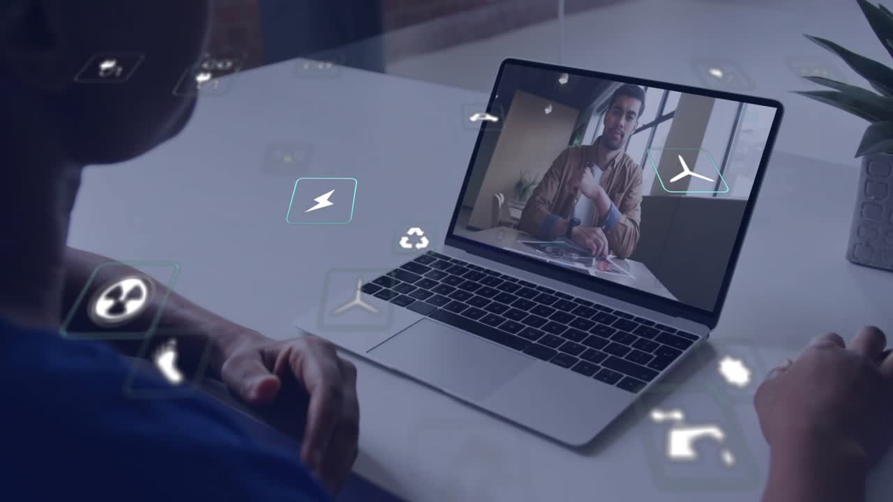 Female colleague tapping power icon then wind turbine icon, enhancing remote energy call visuals