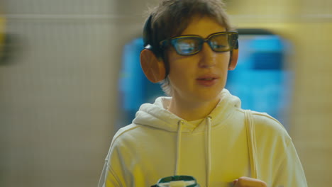 woman in headphones enjoying the music in subway