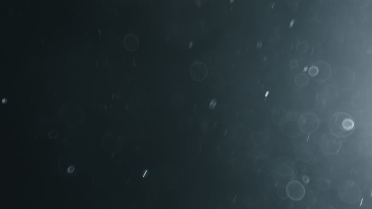 어두운 배경에 떠 있는 추상 입자 보케