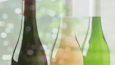 composite of bottles of white, red and rose wine over tree on white background