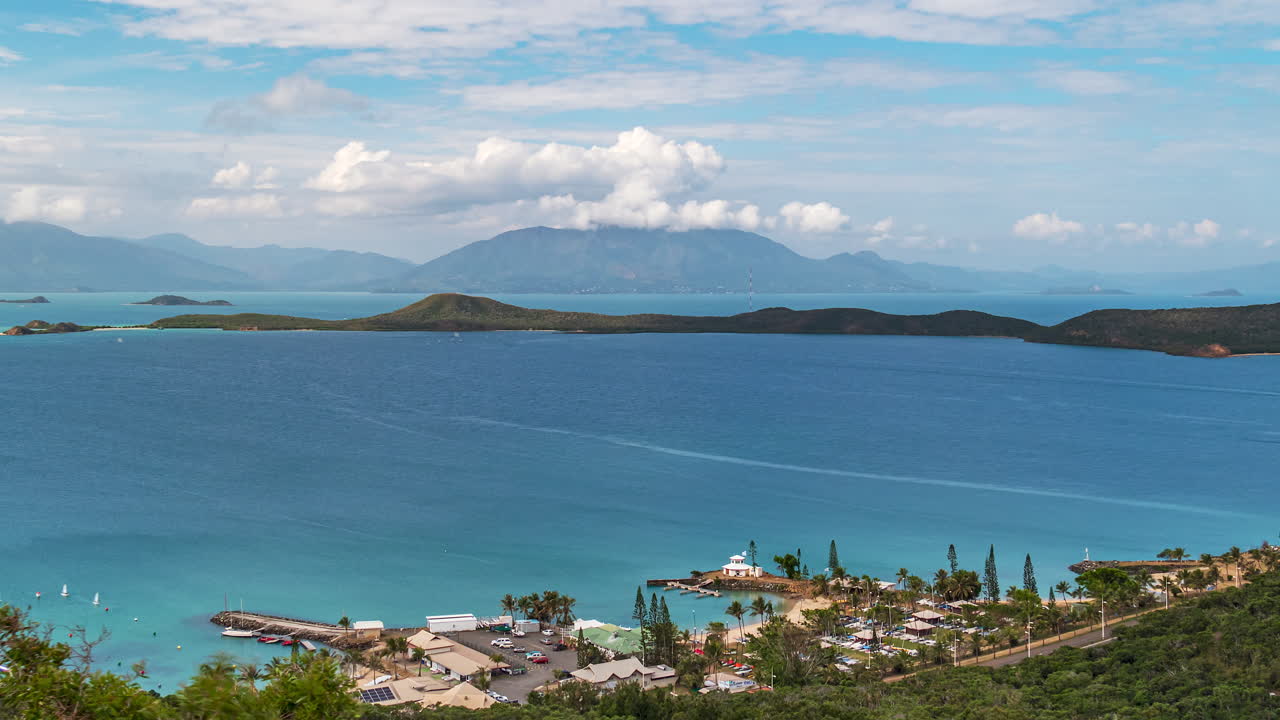 Mont Dore beyond the crystal clear blue waters of the Baie de Sainte Marie in New Caledonia - static time lapse