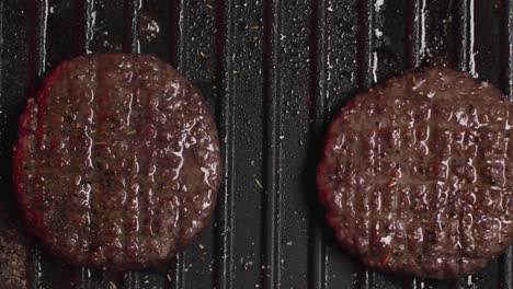 cooking hamburgers on a grill