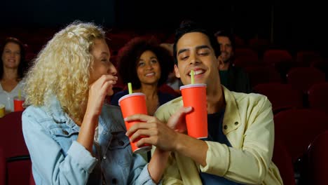 couple watching movie in theater 4k